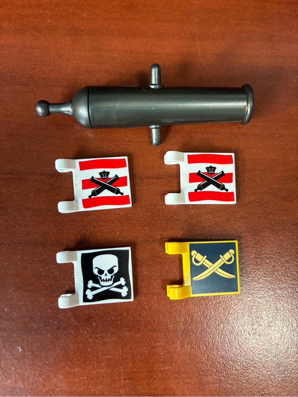 Lego Black Cannon with White, Red, Yellow and Black Pirate Flags